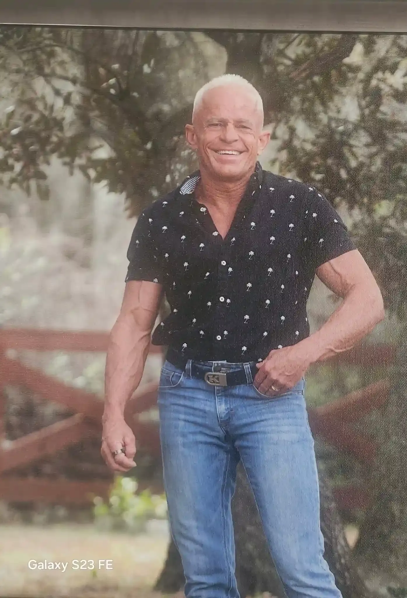 The owner posing outside smiling.